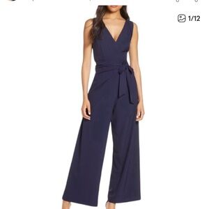 Elegant Navy Sleeveless Jumpsuit with Pockets and Front Tie Size 10